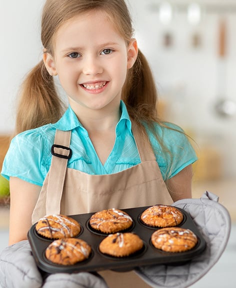 portrait-of-happy-little-girl-preparing-cookies-sh-2023-11-27-05-07-26-utc